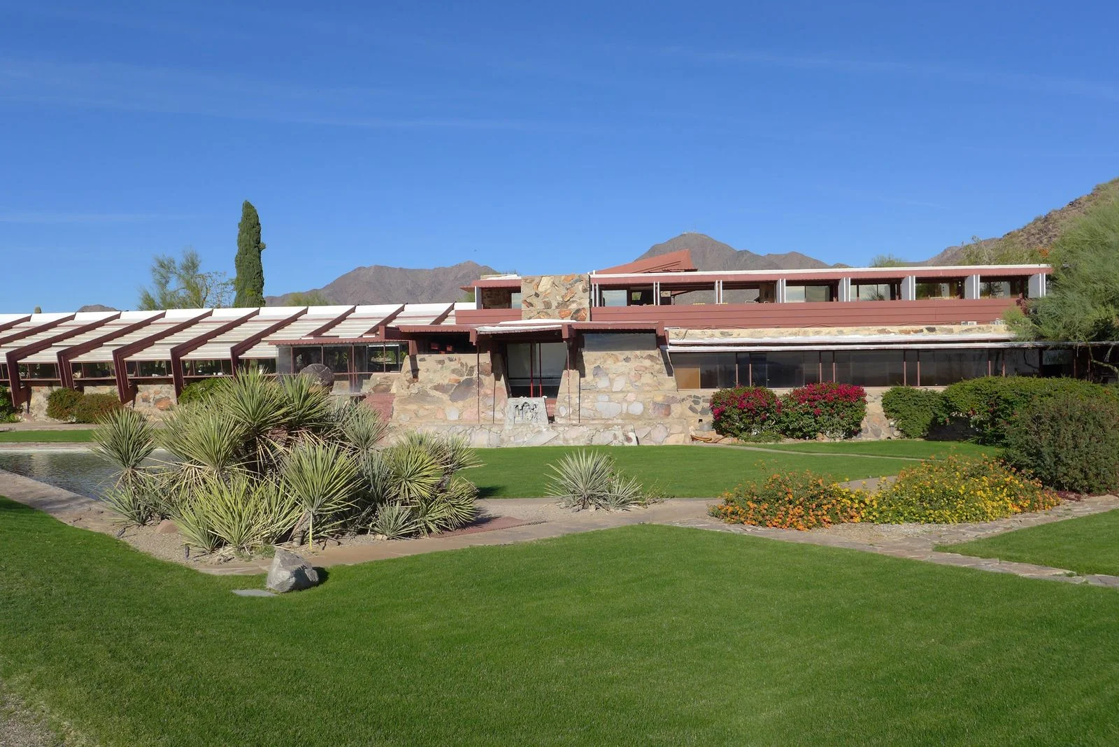 Image may contain Grass Plant Architecture Building House Housing Villa and Lawn