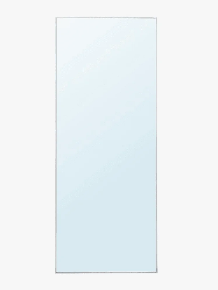 A full length rectangular mirror with a silver border 