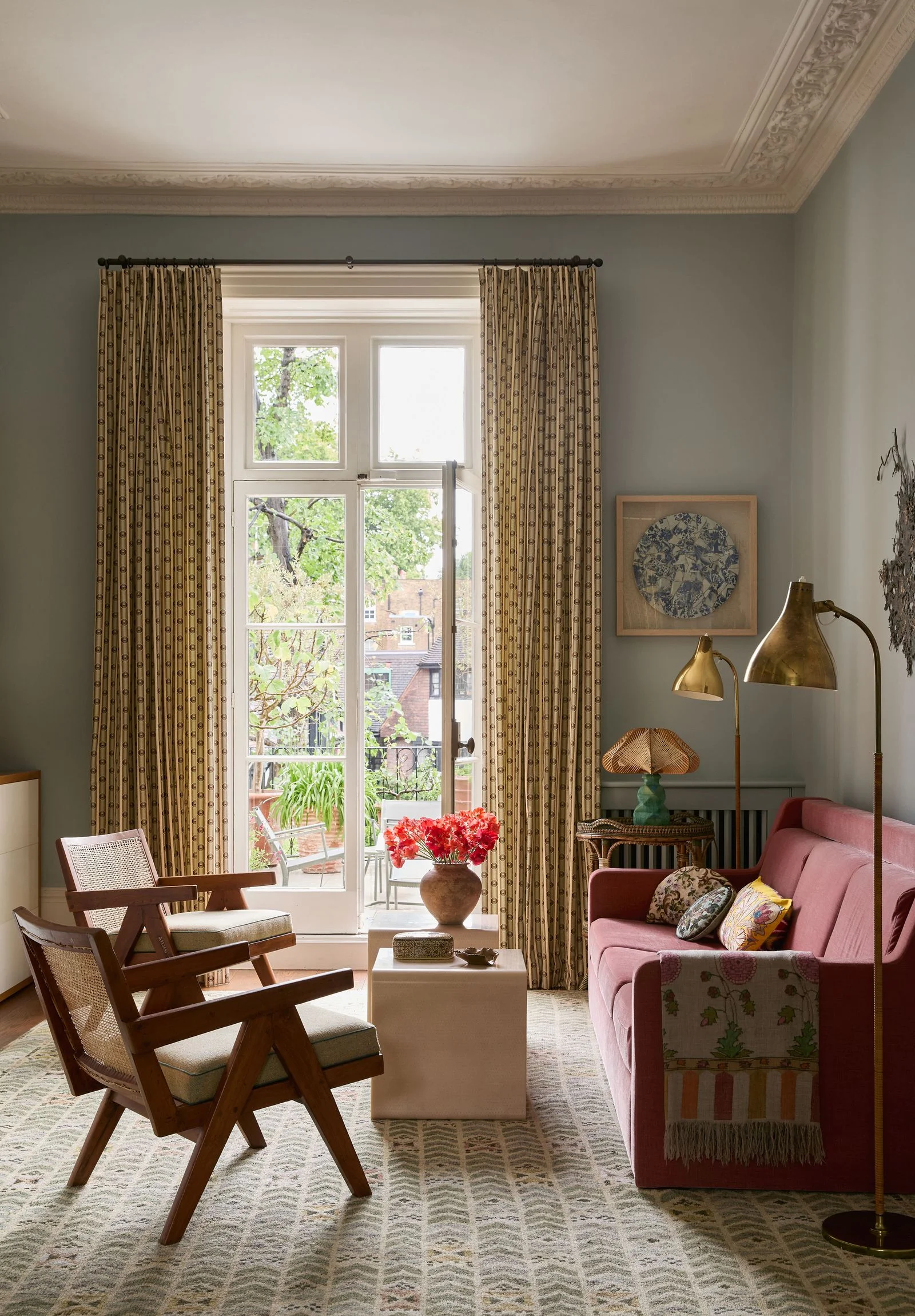 Image may contain Chair Furniture Couch Window French Window Lamp Home Decor Art Painting Rug and Table